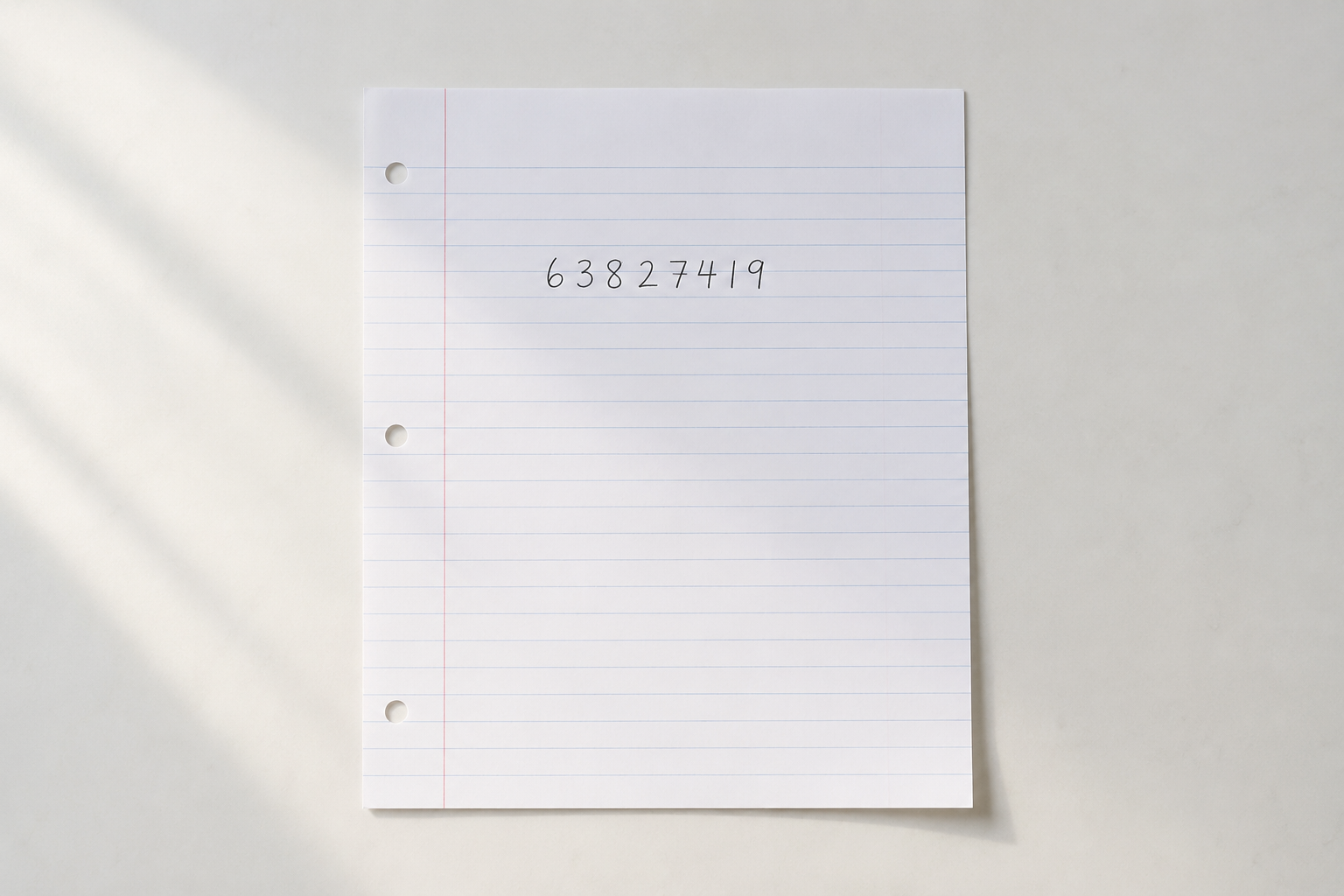 A single handwritten sheet of paper noting the normal range